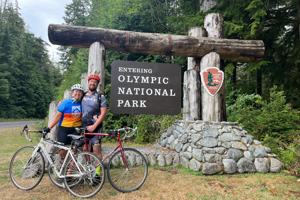 Alumni Kaylyn Messenger with fiance Nick Proctor riding the Olympic Peninsula Bike Tour together.
