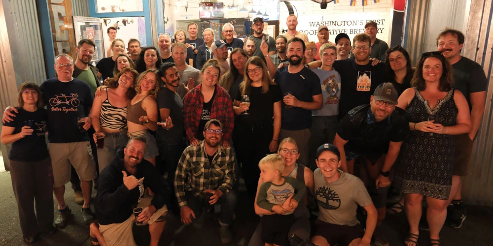 The Olympic Peninsula team celebrating a the Flying Bike Cooperative Brewery.