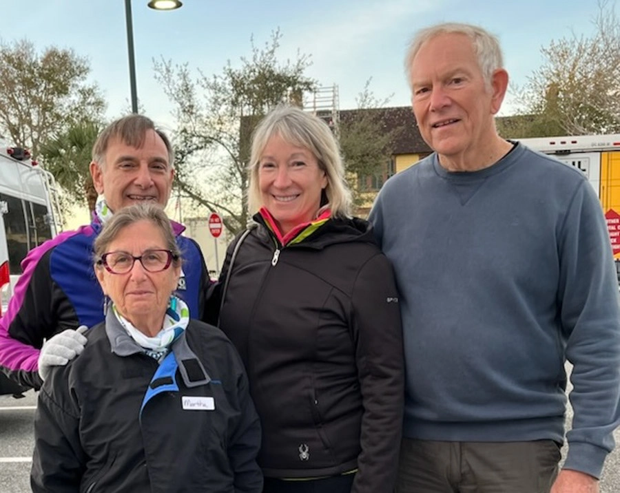 Alumni Jeff Smith and Peggy with Jim and Martha who provided pizza to the TransAmerica team.