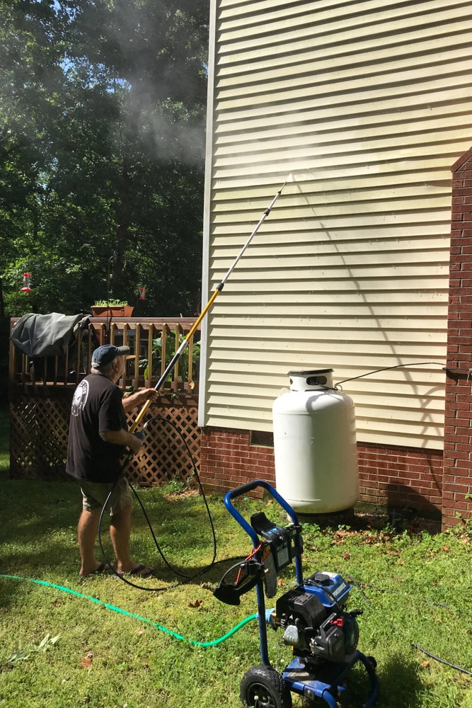 Cleaning up the side of the house.