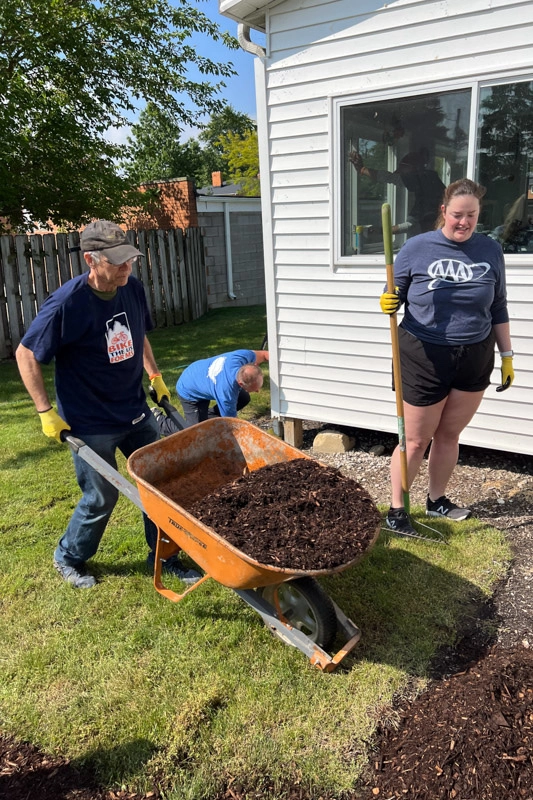 Volunteering with yard work for a family living with MS.